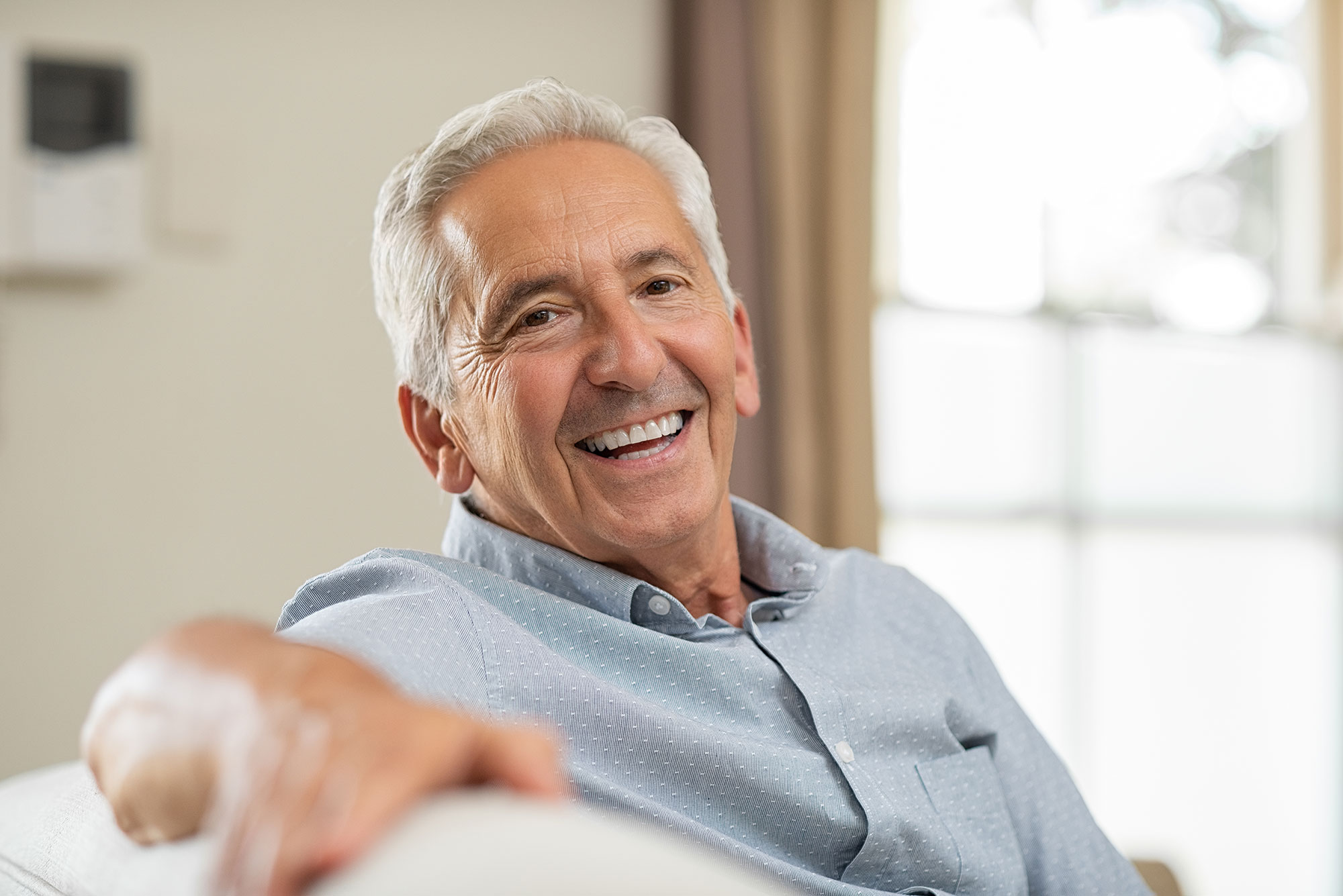 Senior man smiling at home 7bcu8e6 1